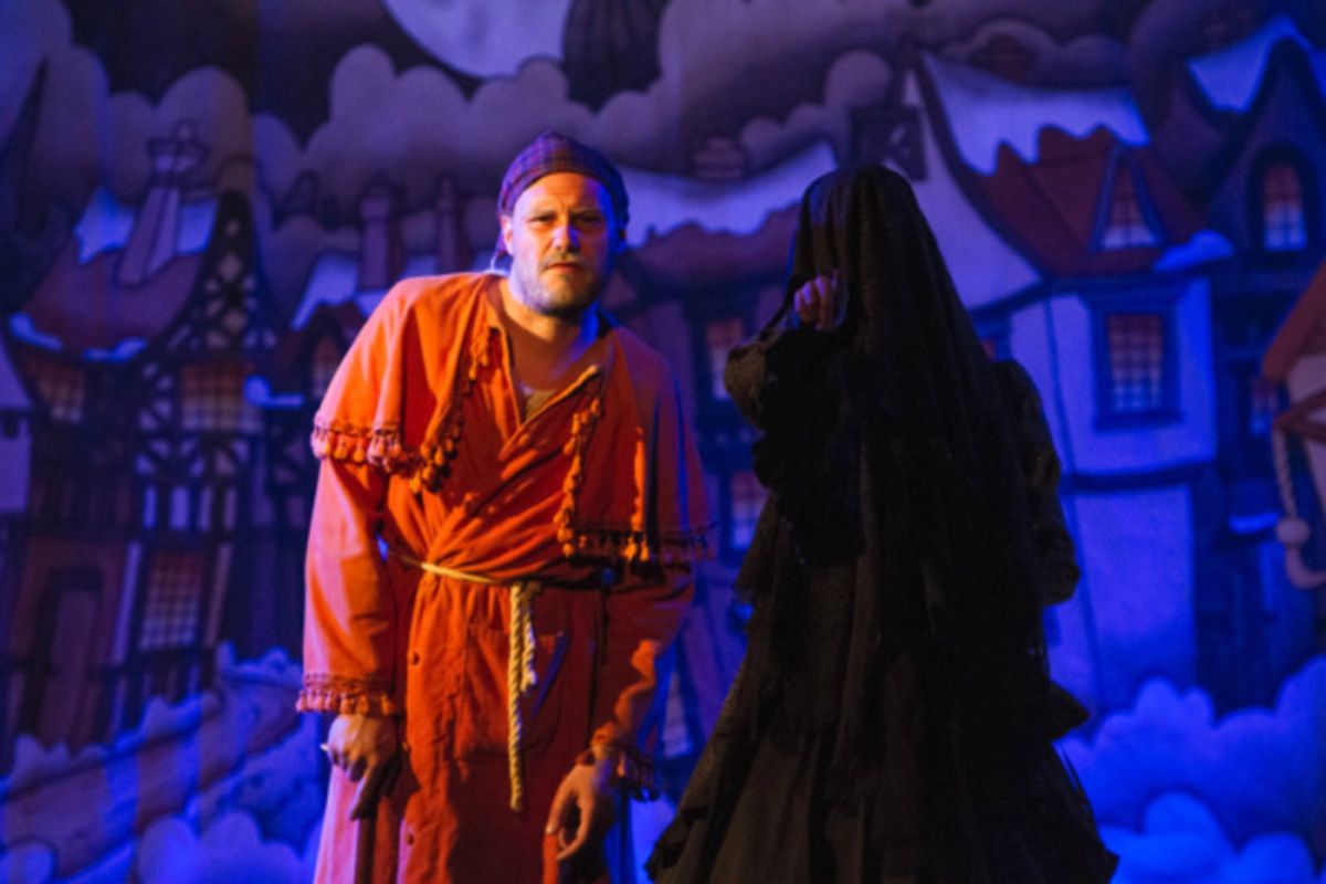 The Ghost of Christmas Yet to Come (Courtney Hansen) points to out the future to Scrooge (Eric Fletcher)

Photo by Martin Harris at 