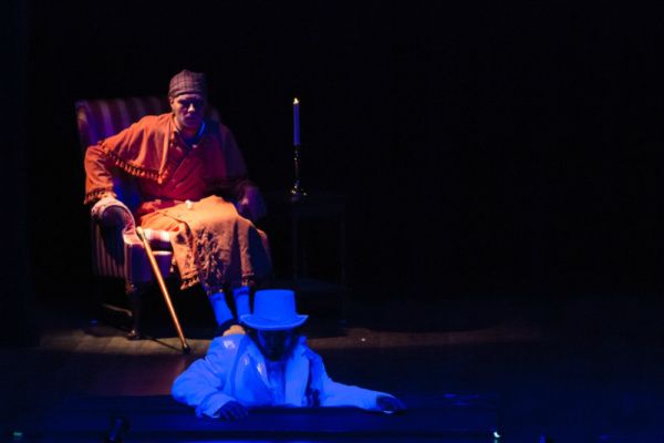 Scrooge (Eric Fletcher) receives a visit from his old partner Jacob Marley (Dustin Sc Photo