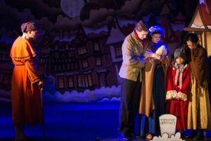 A scene of what could be if Scrooge (Eric Fletcher) does not change his ways
Photo by Martin Harris @ BroadwayWorld A scene of what could be if Scrooge (Eric Fletcher) does not change his ways
Photo b Photo