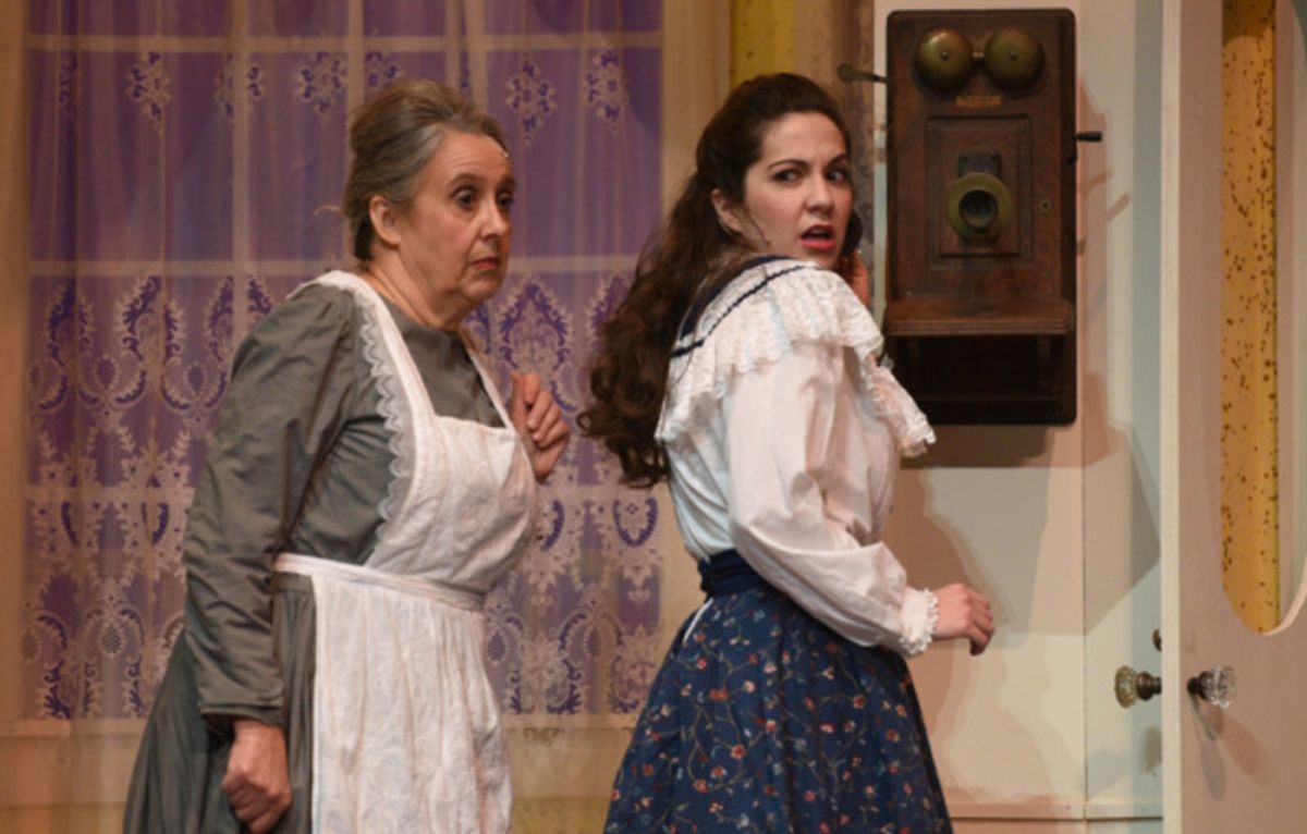 Rose (Lisa Schrock-Ohlinger) reacts to Katie (Mary Rumman) snooping on a telephone call from her beau in a scene from Meet Me in St. Louis at the Croswell. at 