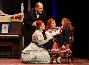 Grandpa (George Reasoner), Anna (Alisa Mutchler Bauer), and Esther (Sarah Hodgman) tend to an injured Tootie (Wynter Osstifin) in a scene from Meet Me in St. Louis. @ BroadwayWorld Grandpa (George Reasoner), Anna (Alisa Mutchler Bauer), and Esther (Sarah Hodgman) te Photo