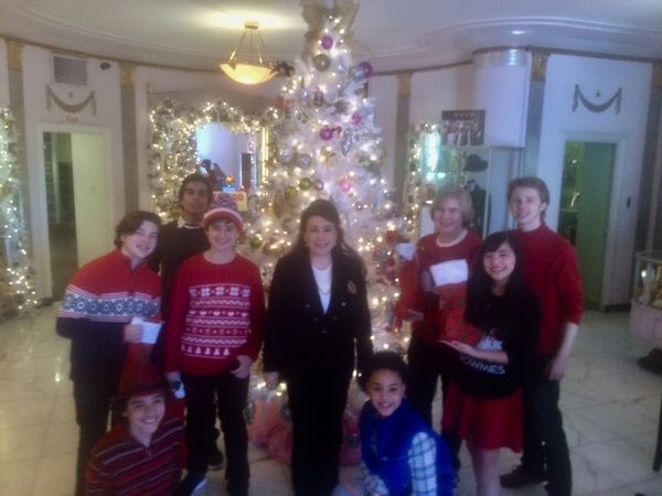  President and Founder of The Hollywood Museum, Donelle Dadigan, surrounded by child  Photo