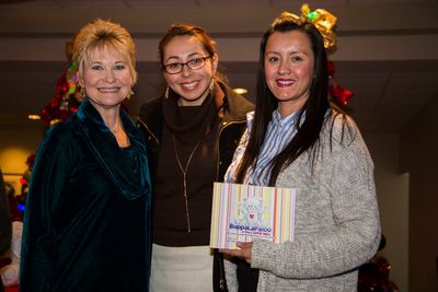 Dee Wallace presents copies of her "BuppaLaPaloo & the I Love Me's" book to Dolores M Photo