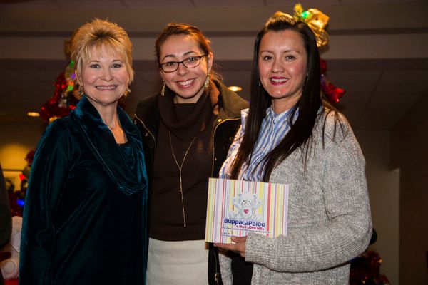 Dee Wallace presents copies of her 
