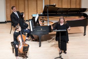 Host and founder Allison Charney welcomes fellow ARK trio members pianist Reiko Uchid Photo