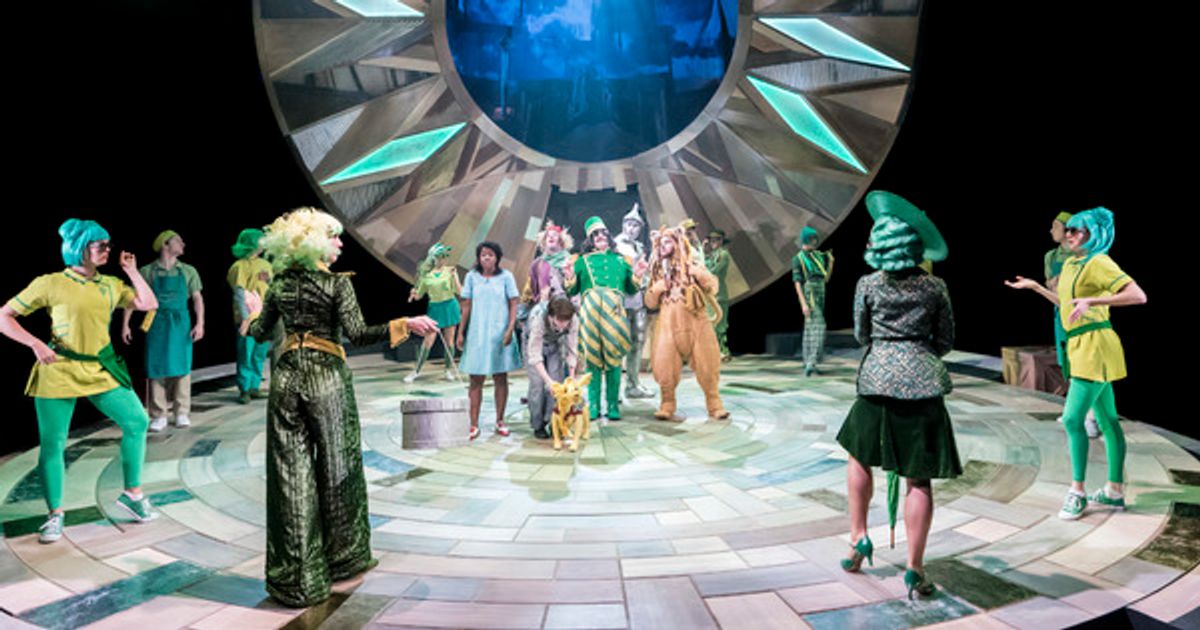 Michael Matus as the Oz Doorkeeper (central) and the cast of THE WIZARD OF OZ at the Crucible Theatre at 
