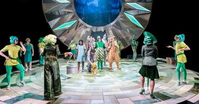 Michael Matus as the Oz Doorkeeper (central) and the cast of THE WIZARD OF OZ at the  Photo