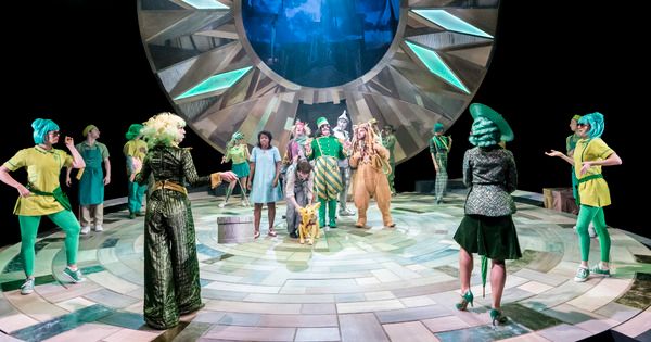 Michael Matus as the Oz Doorkeeper (central) and the cast of THE WIZARD OF OZ at the  Photo