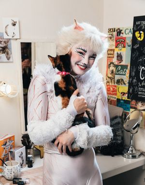 Claire Rathbun of the CATS cast shares a hug backstage with a shelter kitten @ BroadwayWorld Claire Rathbun of the CATS cast shares a hug backstage with a shelter kitten Photo
