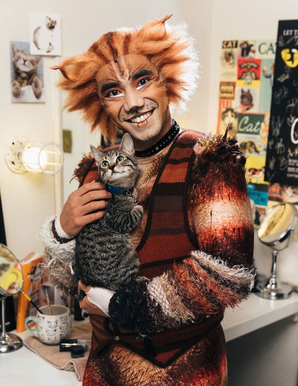 Aaron J. Albano of the CATS cast and an adoptable shelter kitten from The Humane Soci Photo