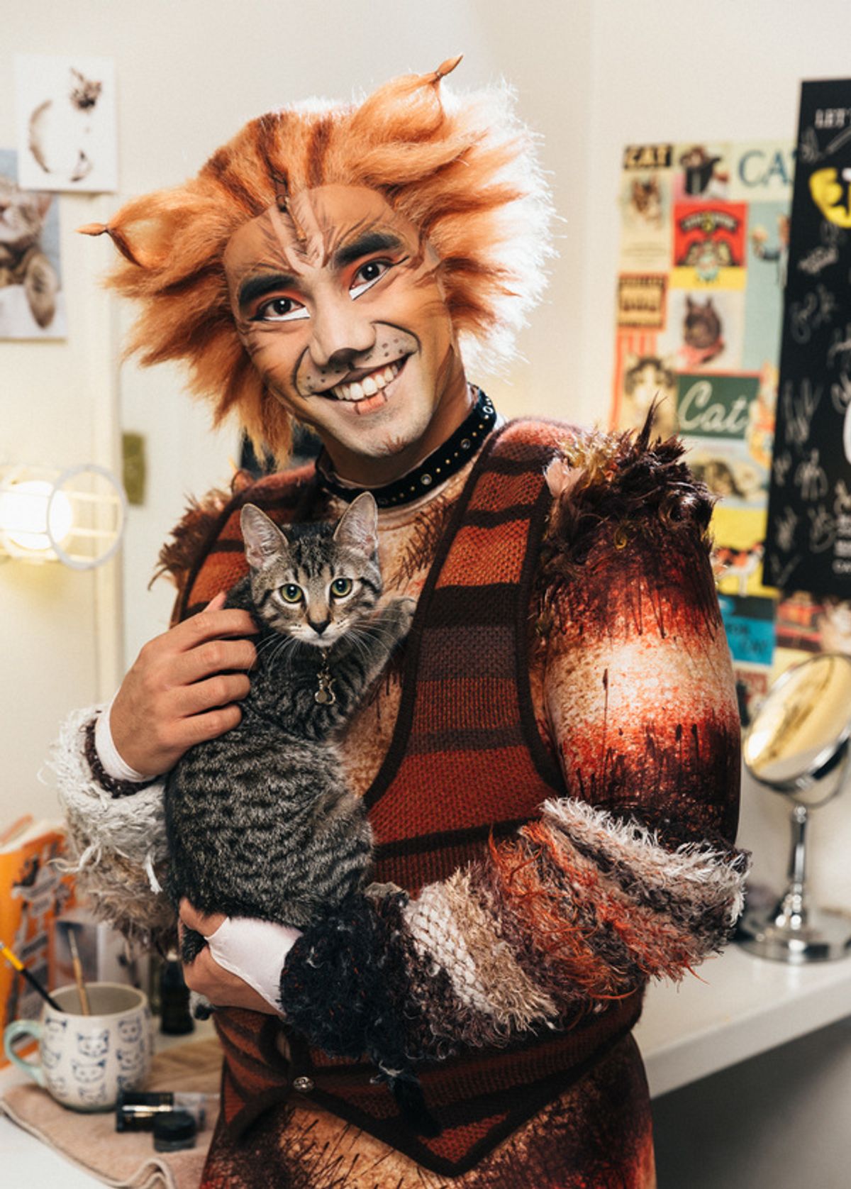 Aaron J. Albano of the CATS cast and an adoptable shelter kitten from The Humane Society of New York at 