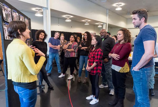 Costume designer Raquel Barreto (left) presents to the company of â€œWater by the Photo