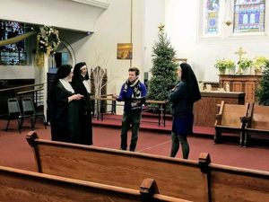 Director Peter Darney with members of the cast Photo