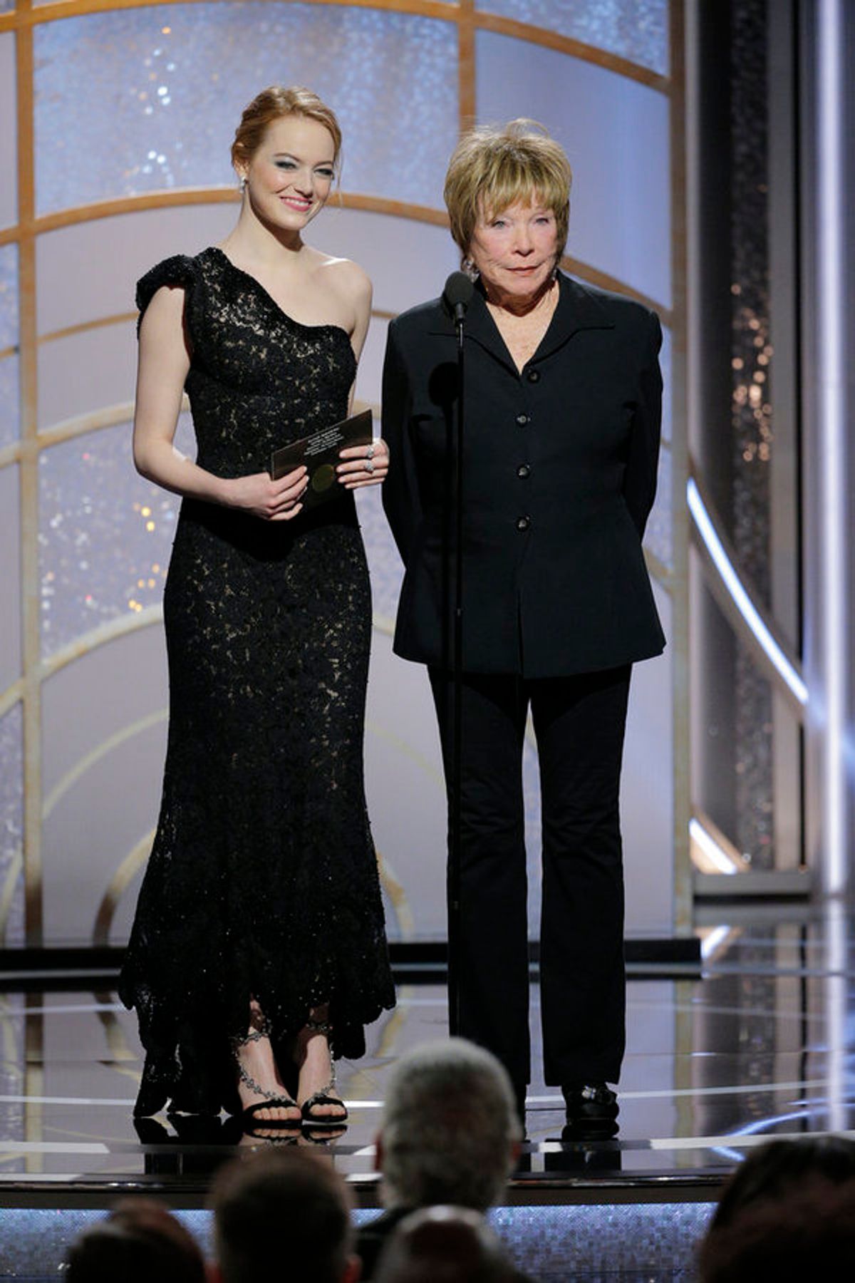 75th ANNUAL GOLDEN GLOBE AWARDS -- Pictured: (l-r) Emma Stone, Shirley MacLaine, Presenters at the 75th Annual Golden Globe Awards held at the Beverly Hilton Hotel on January 7, 2018 -- (Photo by: Paul Drinkwater/NBC) at 