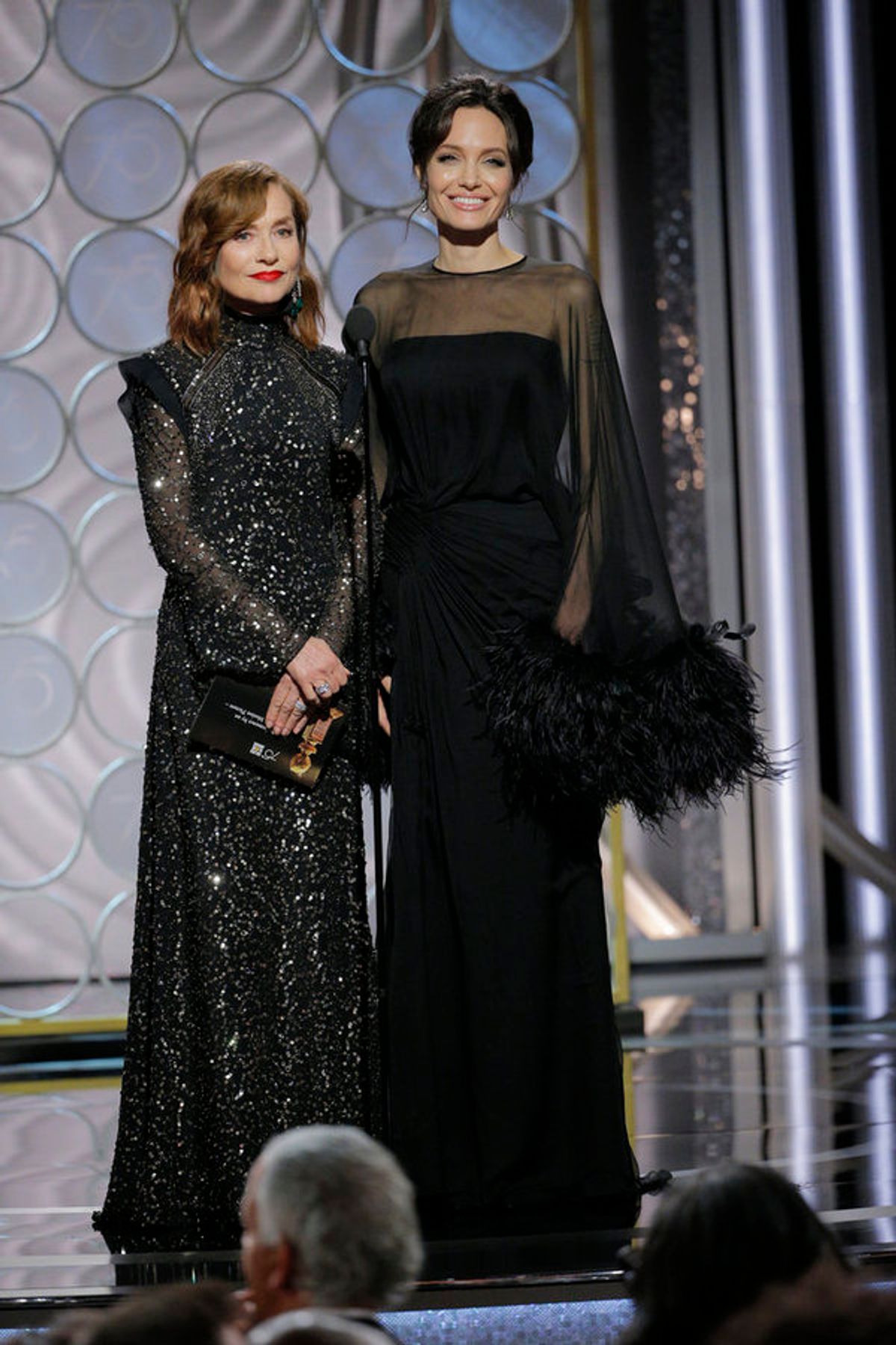 75th ANNUAL GOLDEN GLOBE AWARDS -- Pictured: (l-r) Isabelle Huppert, Angelina Jolie, Presenters at the 75th Annual Golden Globe Awards held at the Beverly Hilton Hotel on January 7, 2018 -- (Photo by: Paul Drinkwater/NBC) at 