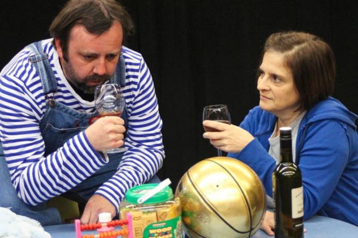 Eric Rupp, as Trevor the chimpanzee, evaluates the bouquet of his glass of wine while his housemate Sandra, played by Kathy Quinn, awaits his verdict, at the Players Club of Swarthmore.  Photo by Rose Azrael. at 