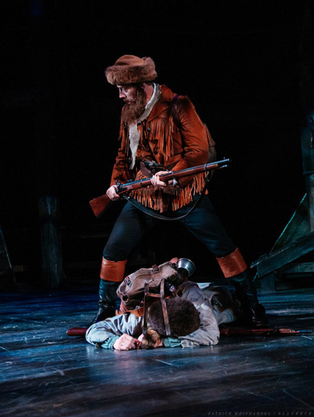 Leif Norby as Robert McClellan standing over Michael Morrow Hammack as John Reed.

 at 