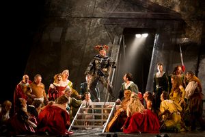 Dimitri Platanias as Rigoletto with The Royal Opera Chorus as Courtiers Photo