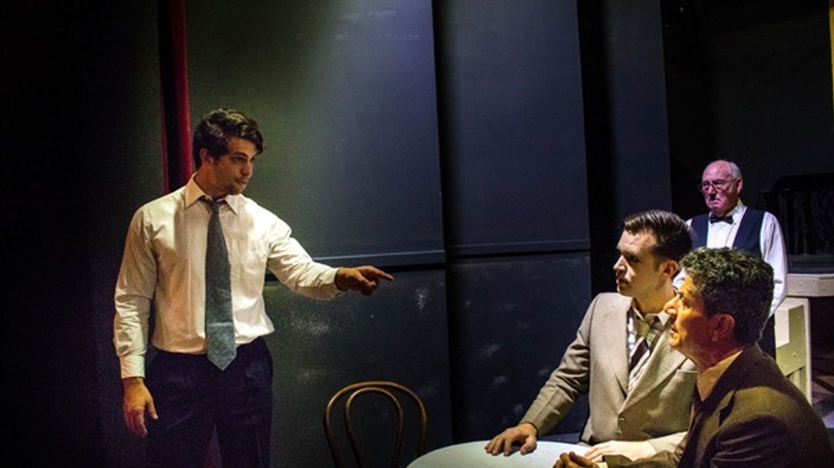Biff (Daniel Moxham) makes a point to Happy (Jason Wall) and Willy (Gino Cataldo) in Death of a Salesman as the waiter (Patrick McLanaghan) looks on. Picture: Daniel Ade

 at 