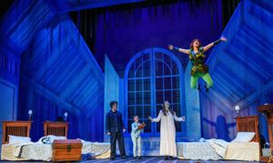 Peter (Hope Valls) teaches John (Fritz Van Winkle), Michael (Rodes Cole), and Wendy ( Photo