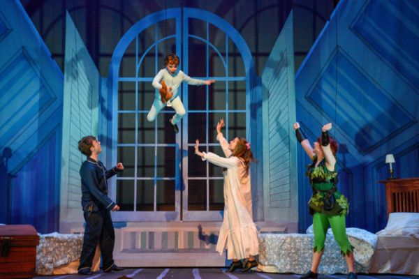 Peter (Hope Valls) teaches John (Fritz Van Winkle), Michael (Rodes Cole), and Wendy ( Photo