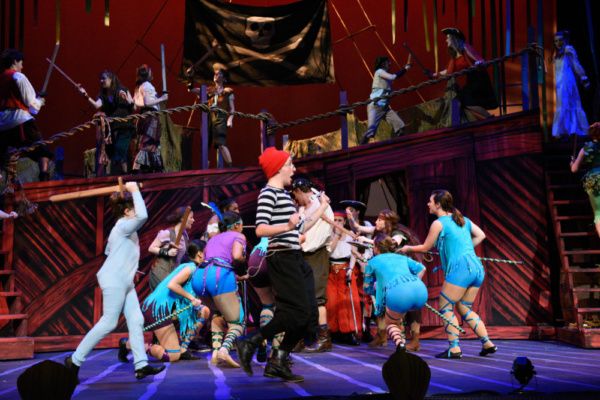 Michael (Rodes Cole) chases Smee (Joe Sear) during Ship Fight. Photo