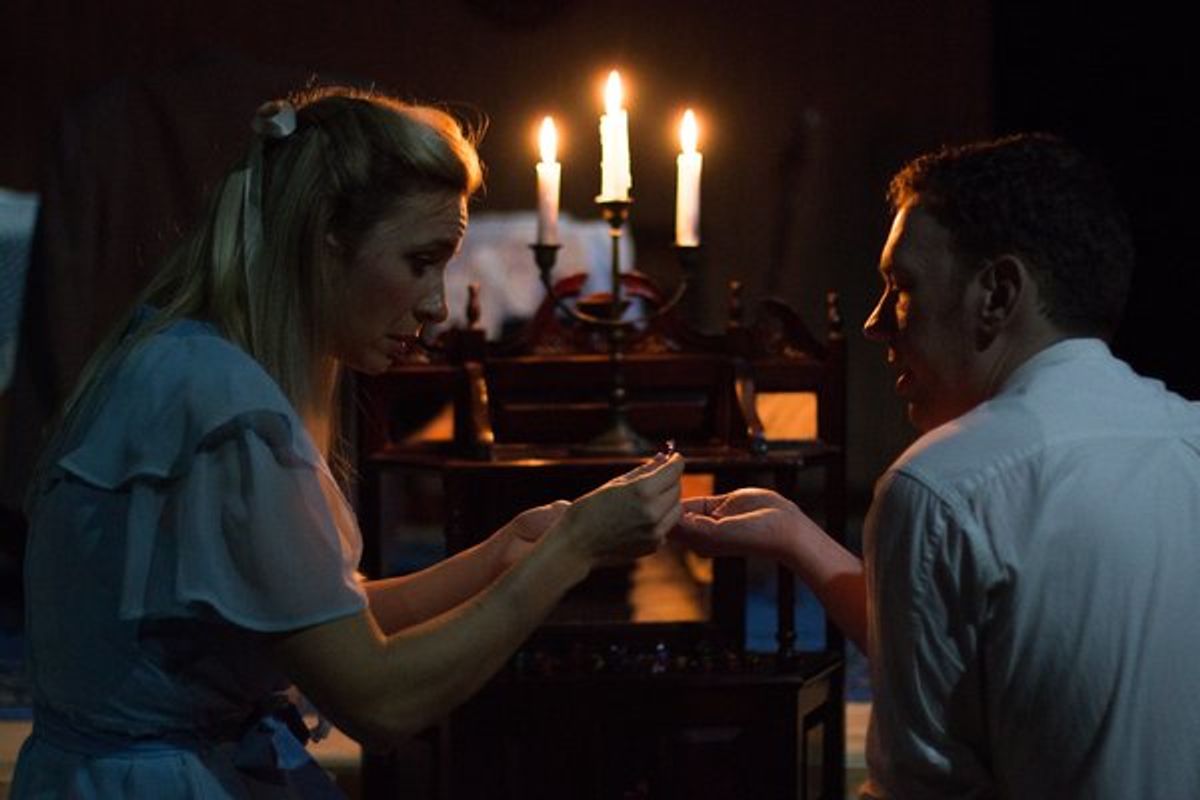 (L to R) JESSICA WEAVER (Laura) and NICK FITZGERALD (The Gentleman Caller) from the Lakewood Playhouse Production of Tennessee Williams' 'THE GLASS MENAGERIE' at 