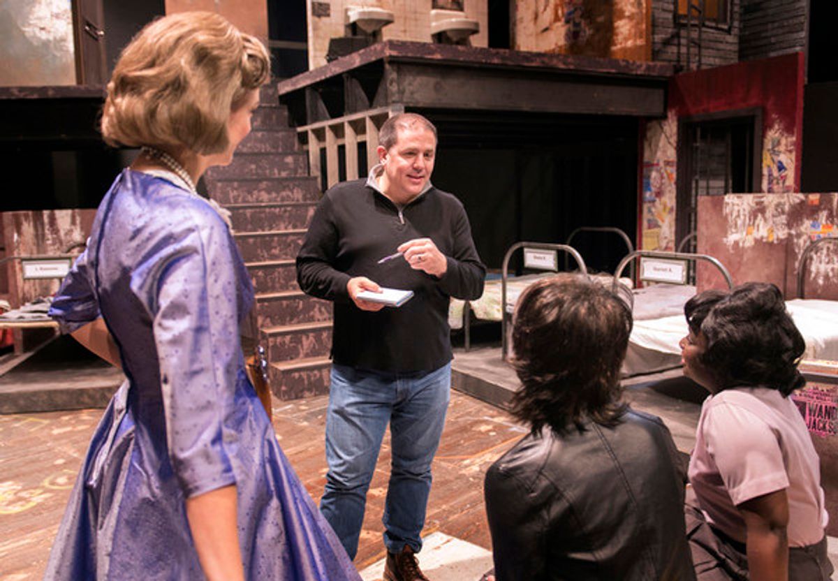 Director John Simpkins discusses notes with members of the cast of Love in a Hate Nation during rehearsal for the production. at 