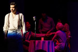 Michael McCray (Che) and the Evita ensemble Photo