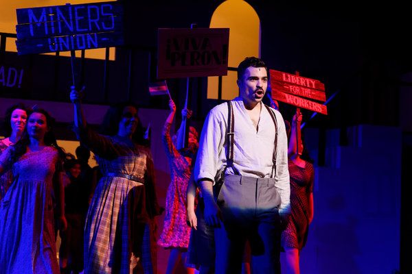 Michael McCray (Cha) and the Evita ensemble Photo