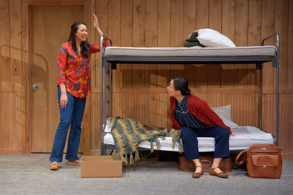 Tong (Jenelle Chu, left) and her mother Huong (Cindy Im, right) arrive at Fort Chaffe Photo