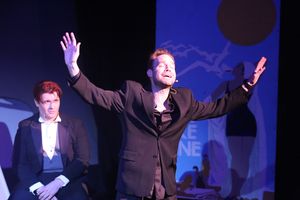 Aaron Allen as Moonface Martin (front) singing "Be Like the Bluebird," with Evan Forn Photo