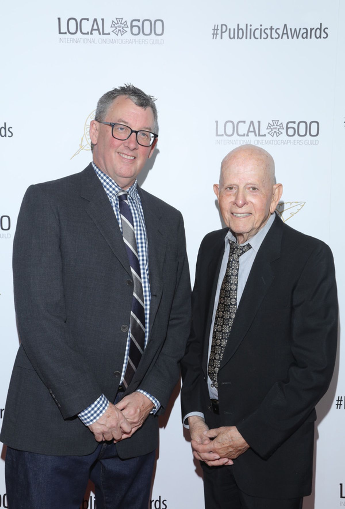 Publicist Awards Co-Chair Tim Menkre (L) and Publicist Awards Chair Henri Bollingre at 