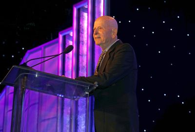Henri Bollinger accepts Honorary Lifetime Achievement Gold Card onstage at the 55th A Photo