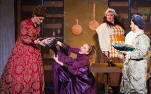Madame (Eric Fletcher) tries to fit the glass slipper on her daughter Bernice (Erica Clare)
Photo by Martin Harris @ BroadwayWorld Madame (Eric Fletcher) tries to fit the glass slipper on her daughter Bernice (Erica Photo