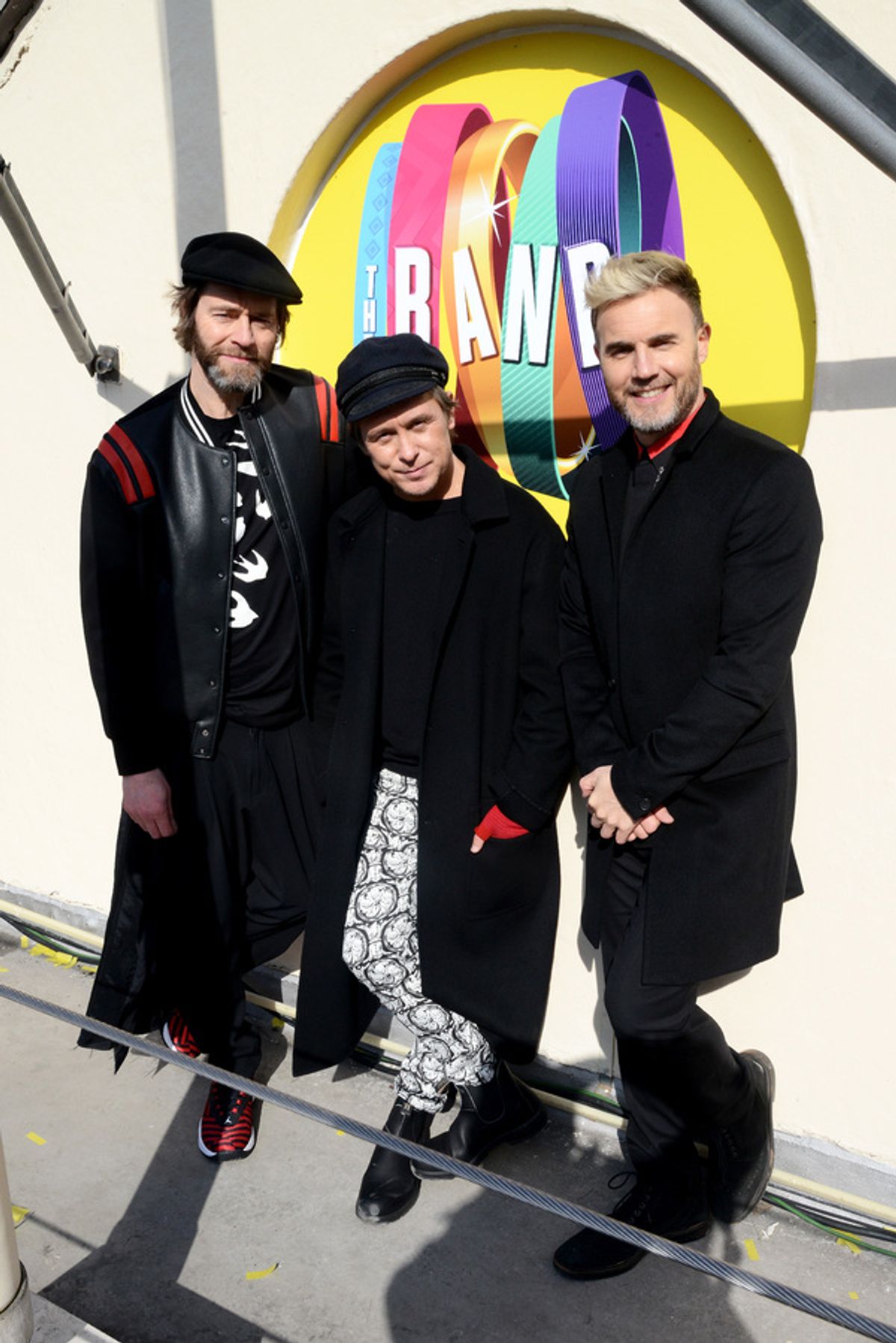 Howard Donald, Mark Owen and Gary Barlow of Take That pose on the roof of The Theatre Royal Haymarket on March 19, 2018 in London, England at 