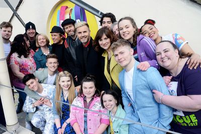 Mark Owen, Howard Donald and Gary Barlow of Take That pose on the roof of The Theatre Photo