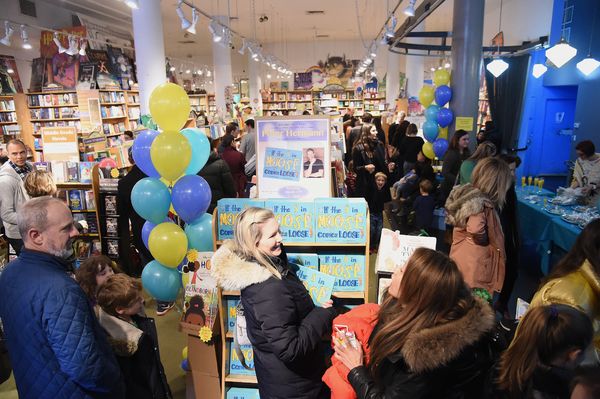 Guests attend the book launch party for Peter Hermann's 