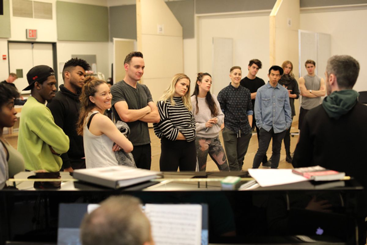 Music Director Bryan Perri (far right) works with the company at 