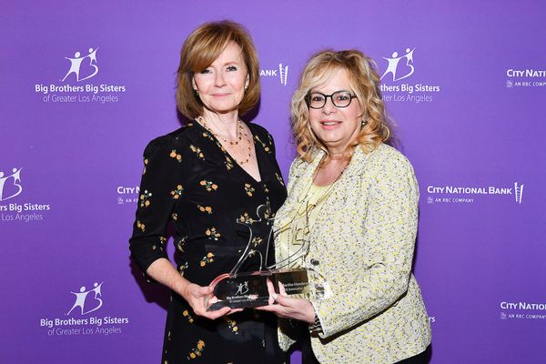 BBBSLA Board Chair Laura Lizer (right) presented the Innovator Award to the EVP of En Photo