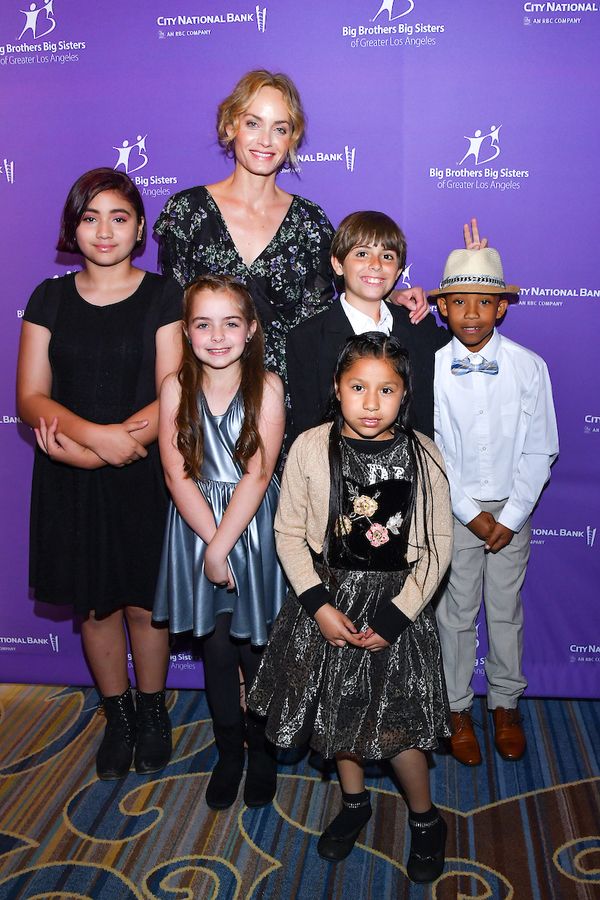 Actress and model Amber Valletta and little brothers and sisters who walked in the BB Photo