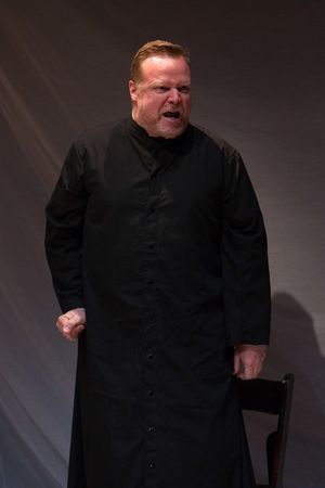 English chaplain John de Stomgumber (Edmund Lewis) fights to see Joan thrown to the fire @ BroadwayWorld English chaplain John de Stomgumber (Edmund Lewis) fights to see Joan thrown to the f Photo