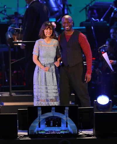 Zooey Deschanel as Belle and Taye Diggs as Gaston Photo