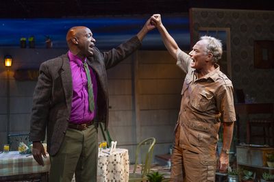 L-R: Friends Steve (Adrian Roberts) and Piet (Victor Talmadge) enthusiastically recit Photo