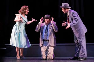 L-R: Mickey (Jim Stanek), Fred (Gabriel Marin) and Natalie (Donna Vivino) explain the Red Channels during a benefit performance in "FINKS" presented by TheatreWorks Silicon Valley at the Mountain View Center for the Performing Arts June 6 to July 1, 2018. @ BroadwayWorld L-R: Mickey (Jim Stanek), Fred (Gabriel Marin) and Natalie (Donna Vivino) explain the Photo