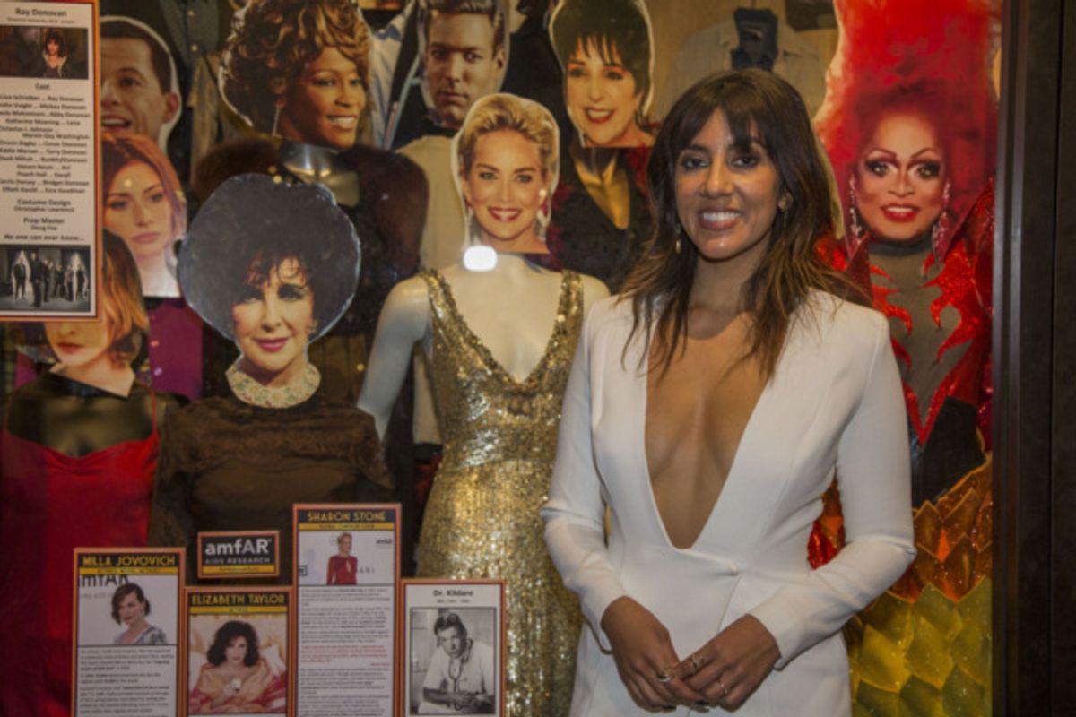 Honoree Stephanie Beatriz with costumes on display worn by LGBTQ Icons and Legends at 