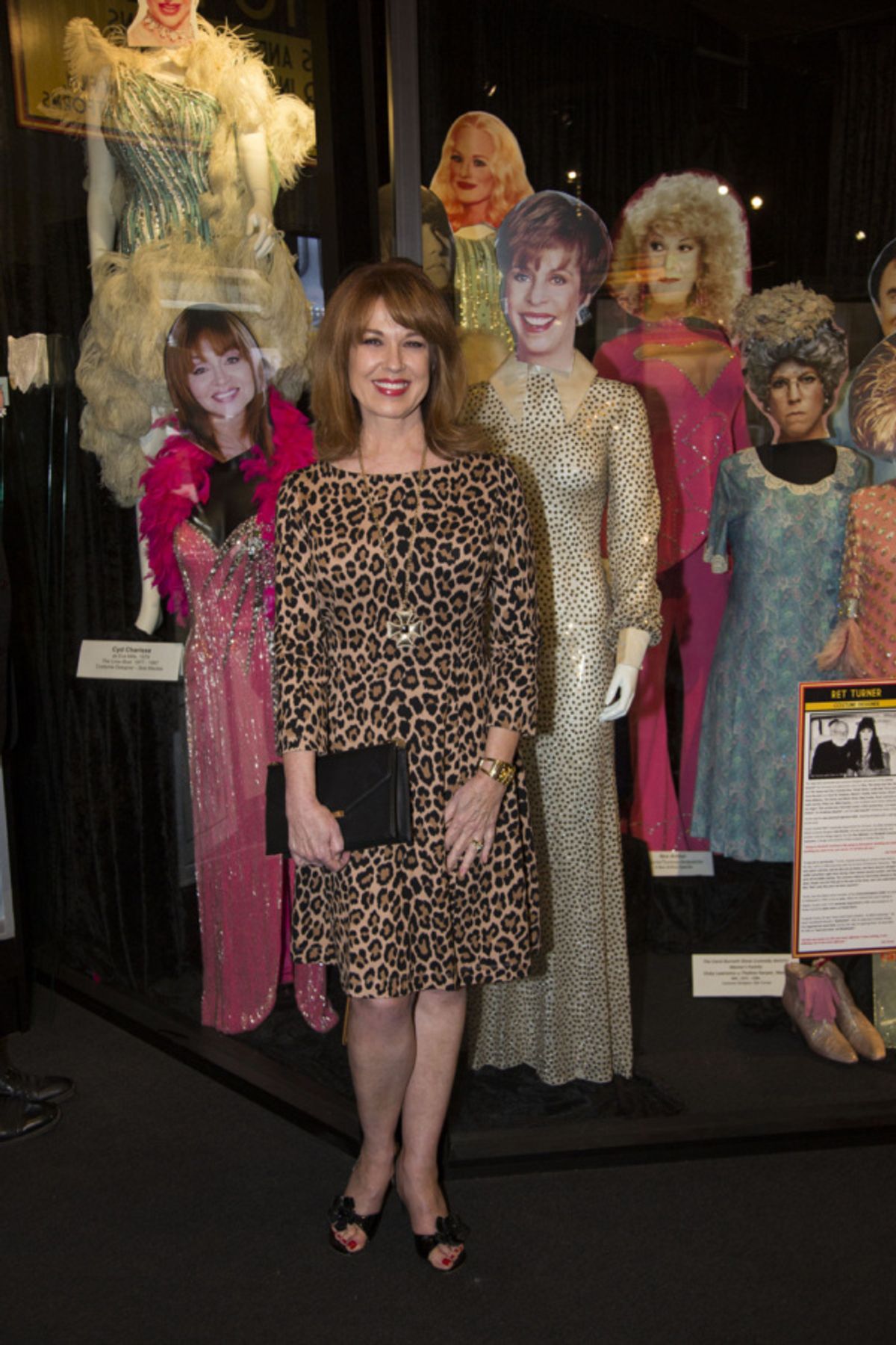 Lee Purcell with costumes worn by fellow Redheads, Judy Tenuta and Carol Burnett, on display at 