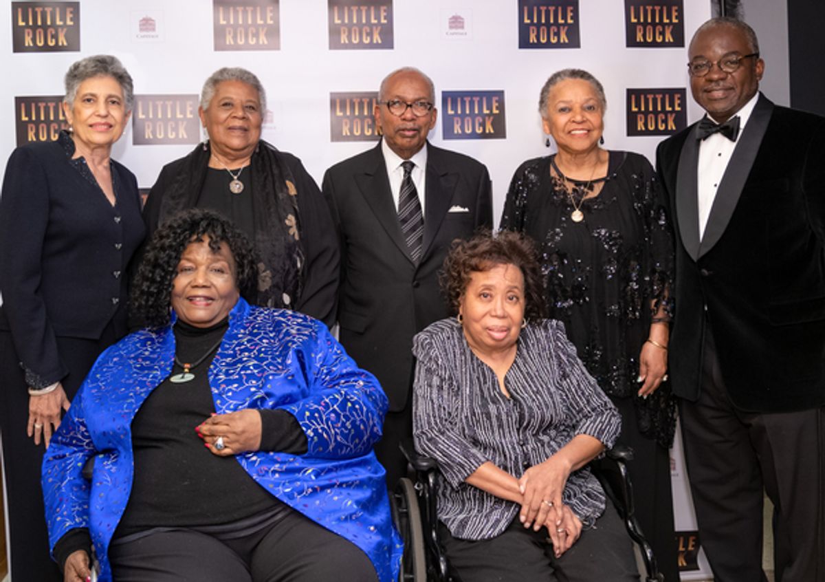 Rear: Carlotta Walls Lanier, Mninijean Brown-Trickey, Ernest Green, Harvey Butler, Gloria Ray Karlmark. Front Row: Melba Pattillo Beals, Thema Mothershed-Wair at 