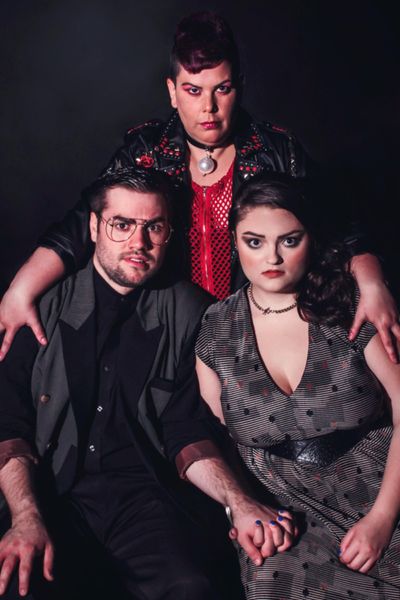 Suzan M. Jacokes (center) stars as Dr. Frank N. Furter, Matt Wallace (left) is Brad M Photo