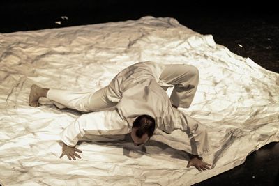 Origami artist and performer Sam Robbins as the "Paper God." Photo by Thomas Wilson @ Photo